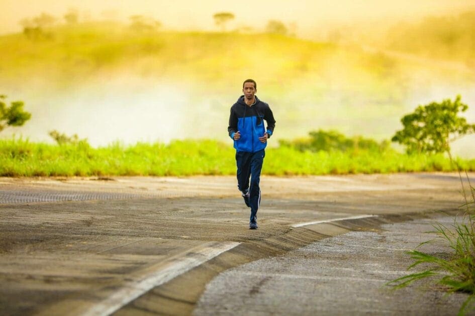 man in track suit jogging on concrete road after Stop Smoking Hypnosis in Brisbane man in track suit jogging on concrete road after Stop Smoking Hypnosis in Brisbane