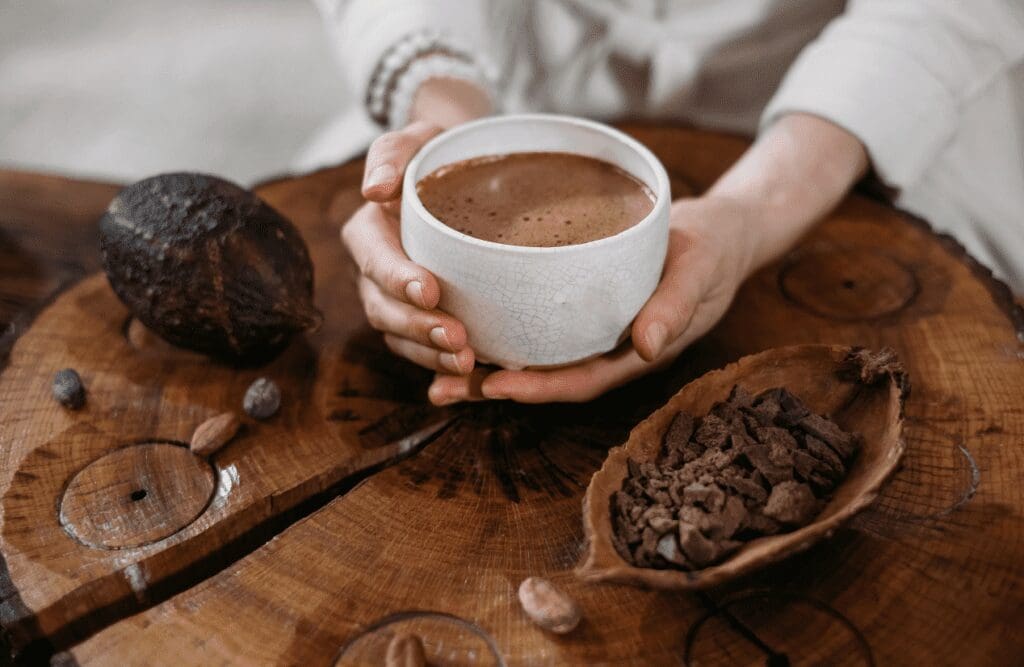 Woman holding a cup of cacao drink. Foods. Brisbane Livewell Clinic
