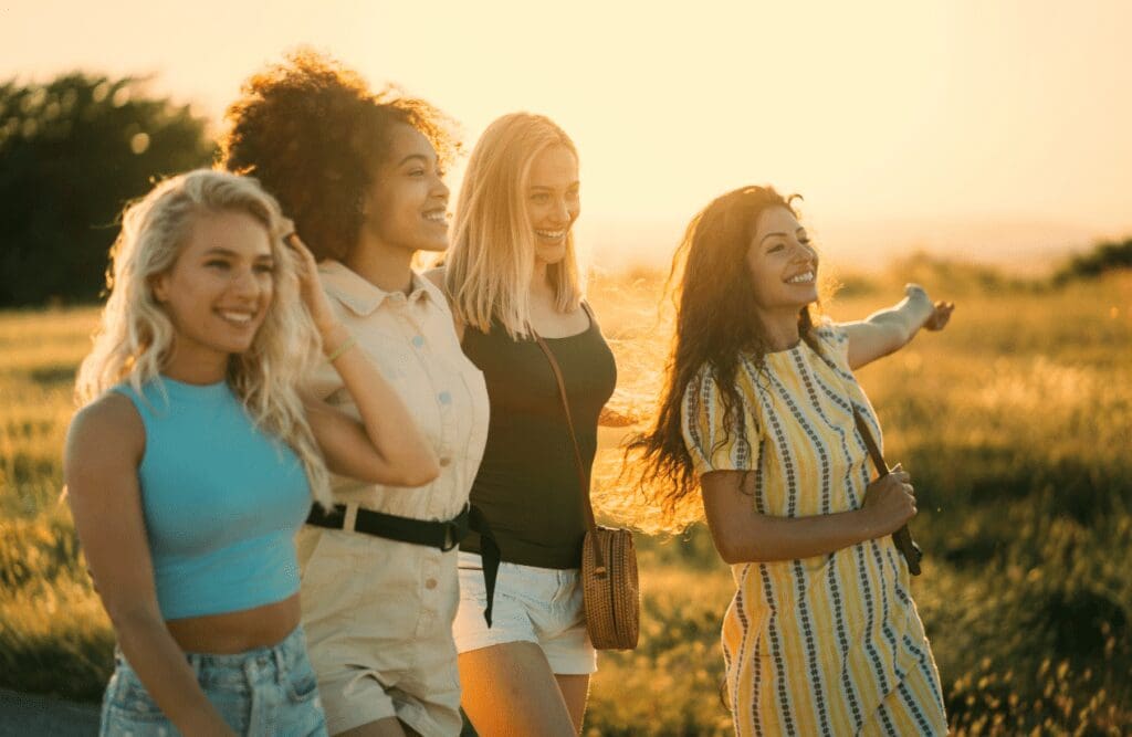 Women walking on a field during sunset. Managing Menopause. At Home Hormone Test. Brisbane Livewell Clinic
