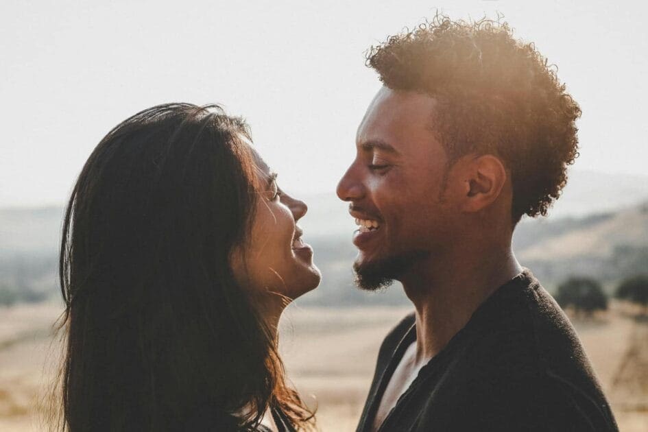 Man and woman facing each other laughing representing successful Hypnotherapy for Alcohol and Drinking at Brisbane Livewell Clinic 