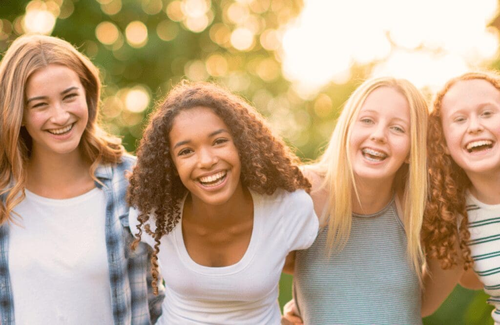 Group of teenager having fun in the park. Foods. Can Osteopathy help Children and Teenagers. Brisbane Livewell Clinic