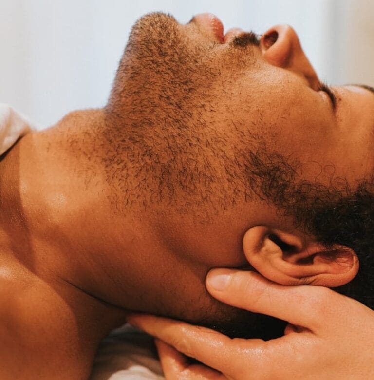 A man getting a remedial massage. Therapeutic Massage Treatment near me. Brisbane Livewell Clinic.
