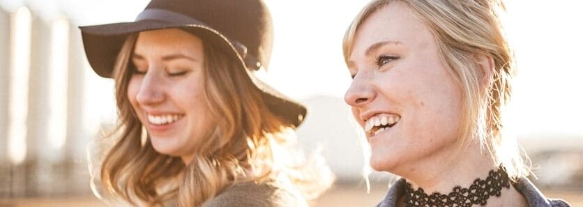 Two women laughing outside. Hypnotherapy Wavell Heights. Why see a Naturopath