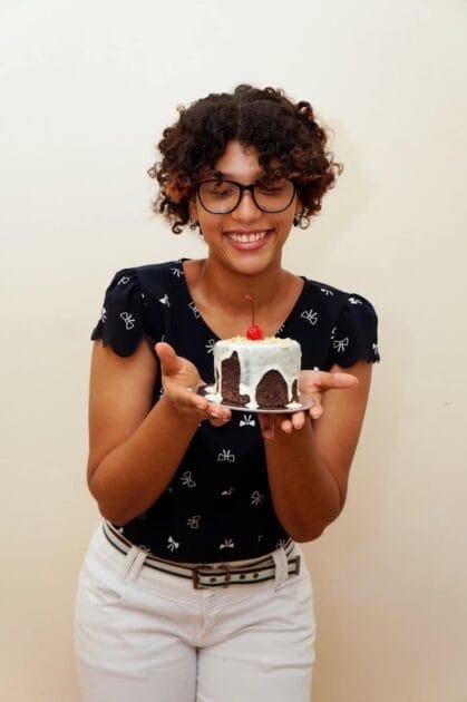 woman in black and white polka dot shirt holding a chocolate cake. Sugar Addiction Science woman in black and white polka dot shirt holding a chocolate cake. Sugar Addiction Science