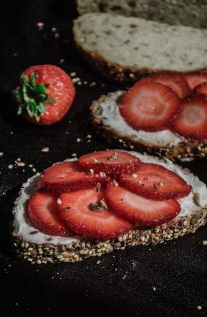 Coeliac Disease. Strawberry cake on black surface. Brisbane Livewell Clinic.