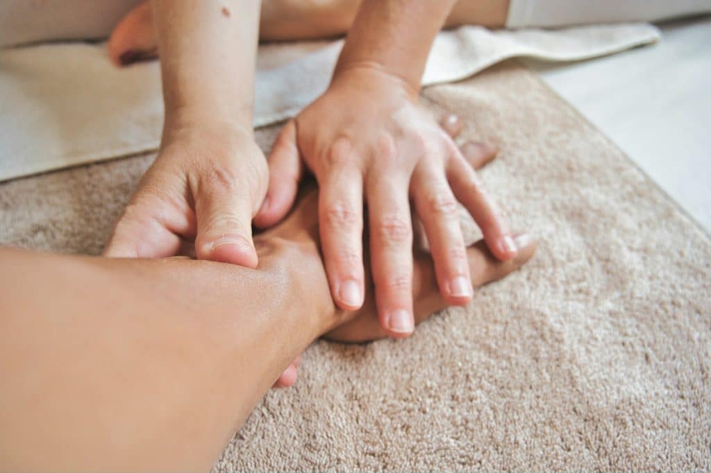 Person getting remedial massage on their arm by a massage therapist. Massage Therapy. Therapuetic Massage Treatment