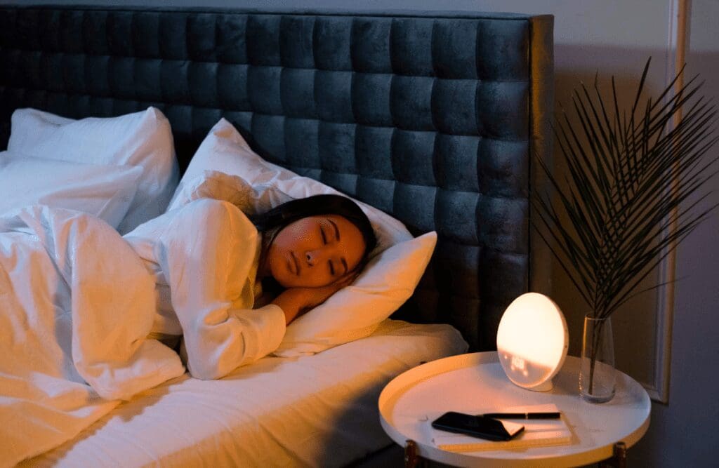 Woman sleeping peacefully on her bed. Hypnotherapy Facts. Impact of Hypnosis on Sleep. Sleep. Brisbane Livewell Clinic