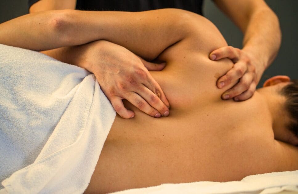 Woman having myofascial release therapy for back pain. Myofascial Release Therapy Massage Near Me. Brisbane Livewell Clinic
