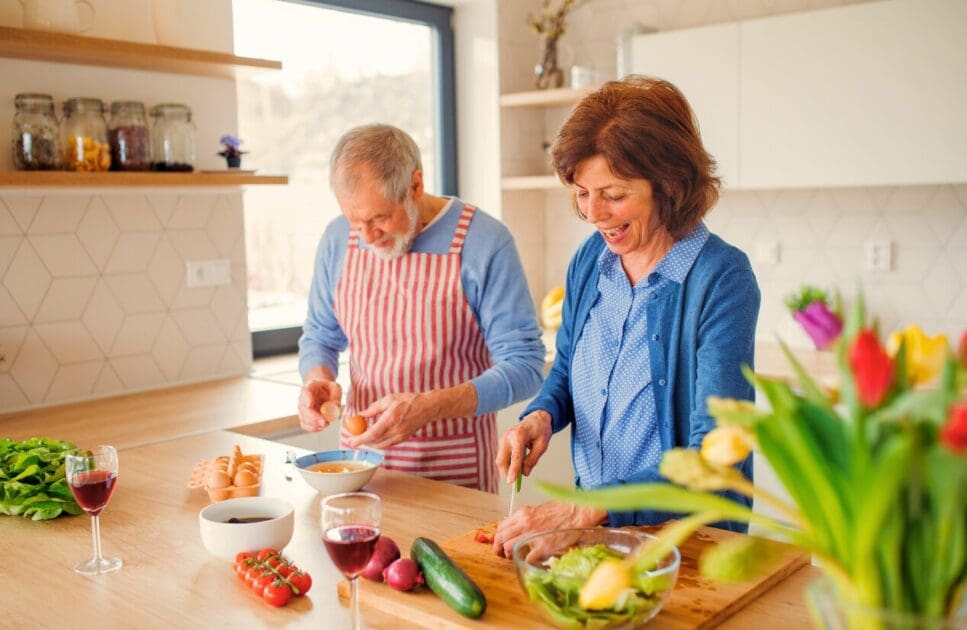Couple preparing a meal together. Happy Menopause. Iron Deficiency. Clinical Nutritionist Morningside. Brisbane Livewell Clinic