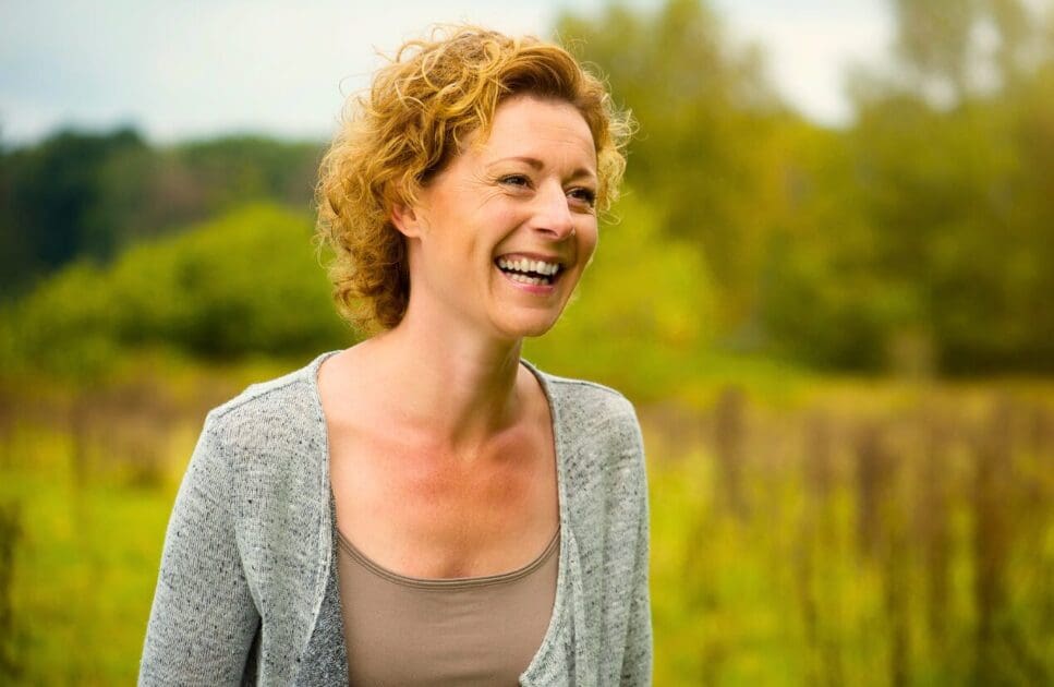 Middle-aged woman having fun in nature. Middle age. Genetic Methylation Test. Menopause. Osteopathy for Arthritis and Joint Stiffness. Brisbane Livewell Clinic