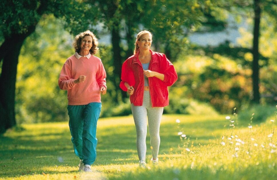 Two women walking together outdoors. Stop Back Pain. Naturopath Blood Test. What is Leaky Gut Australia. Osteopath for Hip Pain. Brisbane Livewell Clinic