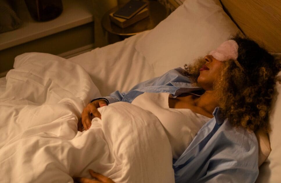 Woman sleeping with a sleep mask. Stop Back Pain. Self-Isolate. Better Sleep. Sleep. Brisbane Livewell Clinic