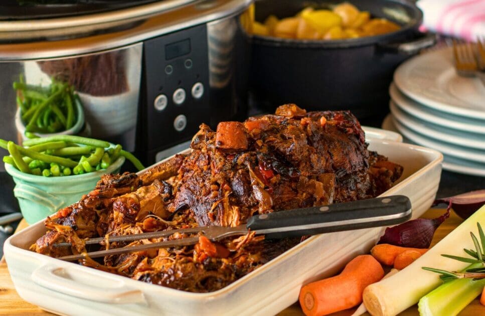 Slow cooked roast pork in white serving dish. Winter Wellness. Brisbane Livewell Clinic