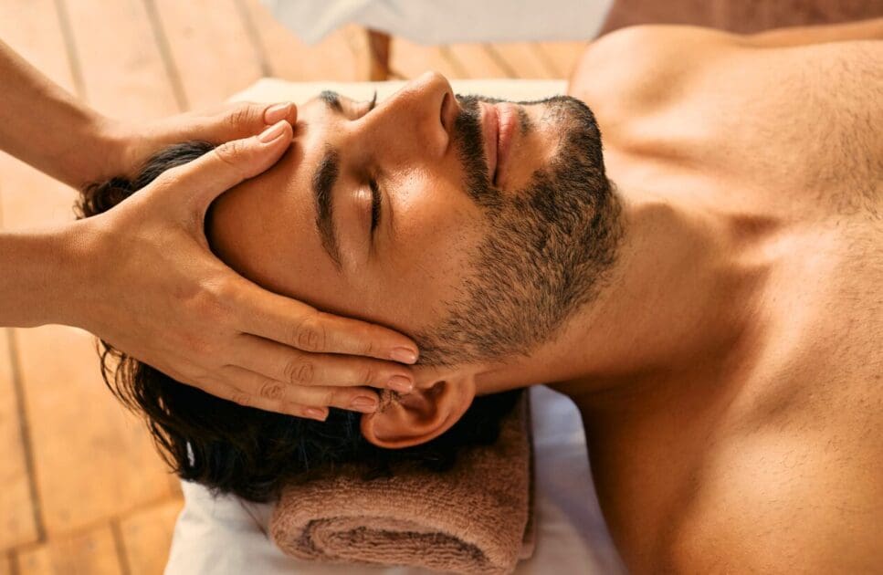 Man receives a relaxing head massage. Father's Day. What is Indian Head Massage. Indian Head Massage Brisbane. Best Head Massage Near Me. Brisbane Livewell Clinic