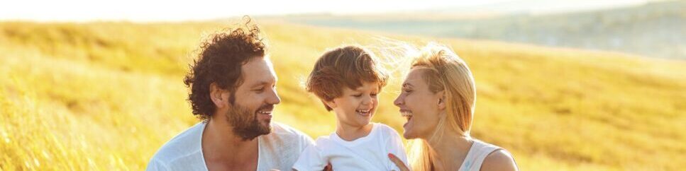 Family having fun in the field. Brisbane Wellbeing. Family Counselling. Brisbane Livewell Clinic