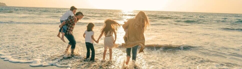 Family enjoys a sunset walk on the beach. Cortisol Test Australia. Does Bowen Therapy Actually Provide Relief. Brisbane Livewell Clinic