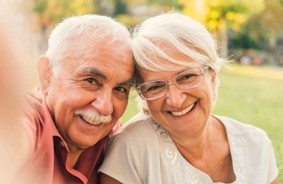 Middle-aged couple taking a selfie. Naturopath Noosa. Health screening. Age. Professional Bowen Therapy. Osteopathy for Arthritis and Joint Stiffness. Brisbane Livewell Clinic