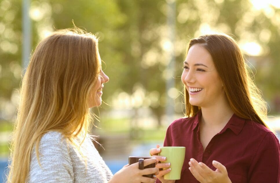 Two women having a conversation outdoors. Clinical Nutrients. I Need Mentoring That Understands How I Think. Brisbane Livewell Clinic