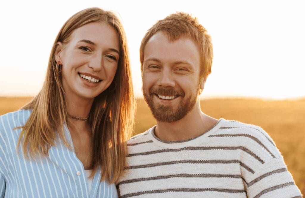 Young couple smiling after a successful hypnotherapy session. Power of Hypnosis. Osteopath Brisbane. What happens during Hypnotherapy. Pyrrole Disorder. Brisbane Livewell Clinic