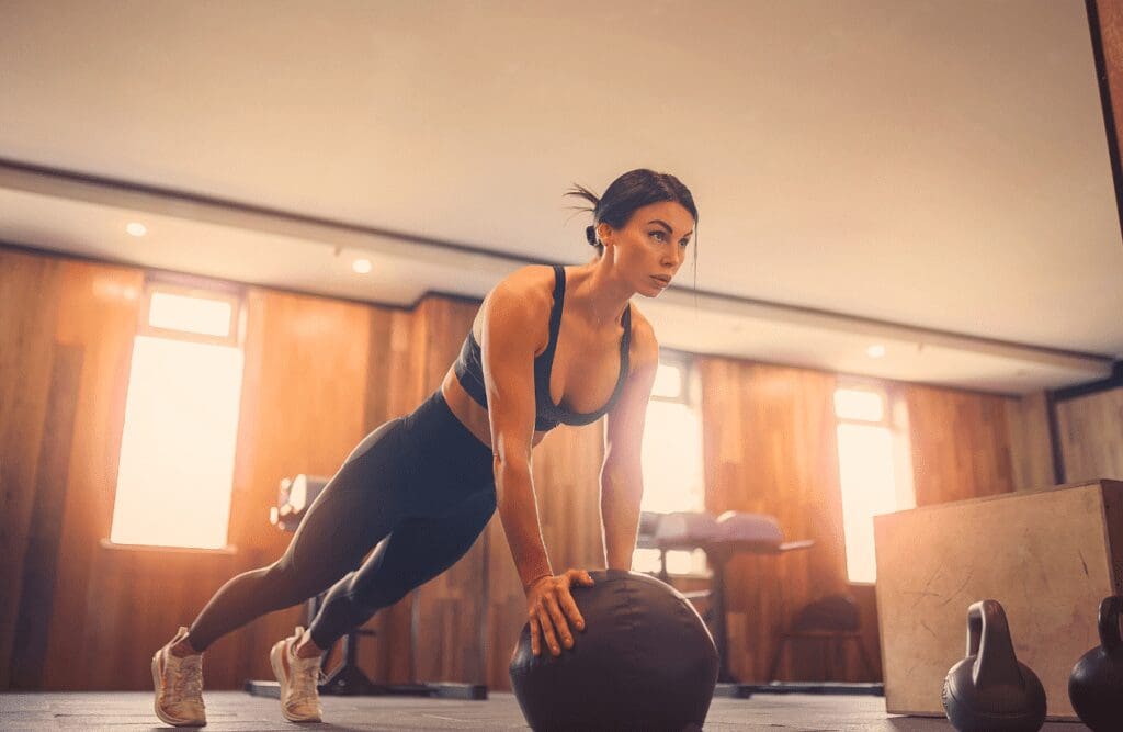 Woman doing swiss ball plank. Gut Health Brisbane. Brisbane Livewell Clinic