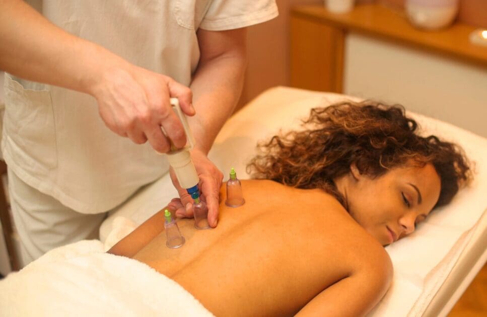 Young woman during a cupping therapy. Cupping Near Me. Brisbane Livewell Clinic