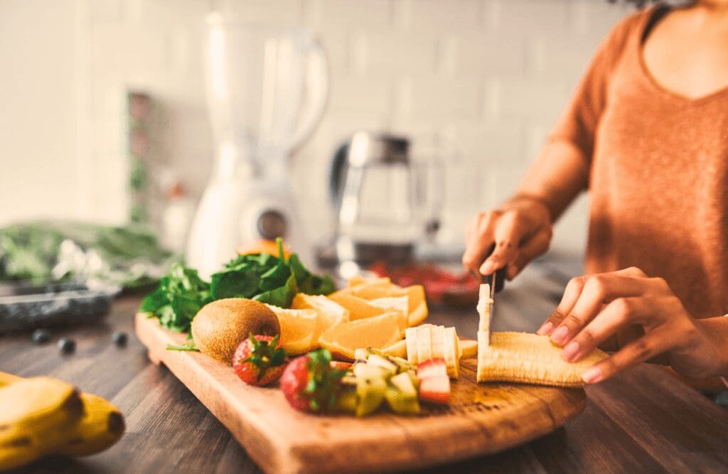 Woman preparing a healthy snack at home. Nutrition and Naturopathy. Brisbane Livewell Clinic