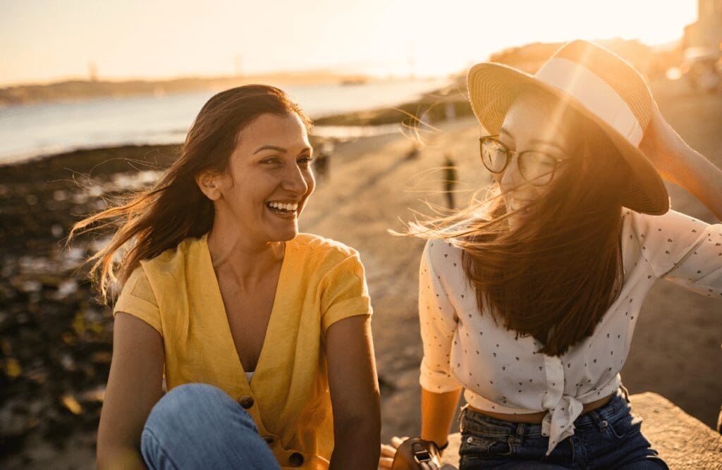 Two young women enjoying each other's company. Hypnosis Therapy in Melbourne. Clinical Nutritionist Carina. Holistic Counselling Northgate. Brisbane Livewell Clinic