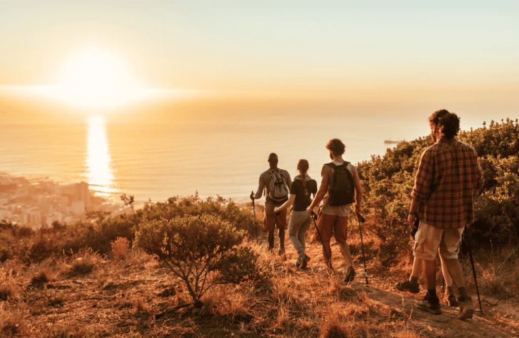 A man running on the beach at sunset after Hypnosis for Smoking.