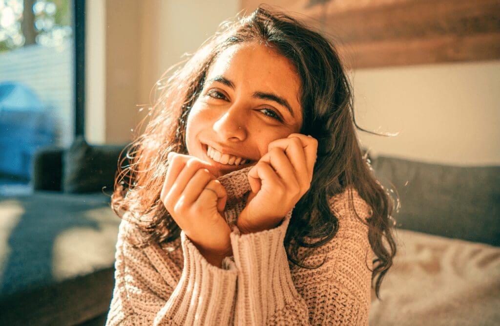 Young woman smiling. Gut brain connection. Naturopath vs Homeopath. Osteopathy and Sleep Support. Counselling Brisbane. Neck Sleeping Position. Osteopathy vs Chiropractic vs Physiotherapy. Brisbane Livewell Clinic