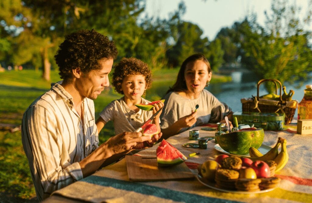 Family on a picnic eating watermelon. Counselling Wavell Heights. Clinical Nutritionist Balmoral. Brisbane Livewell Clinic