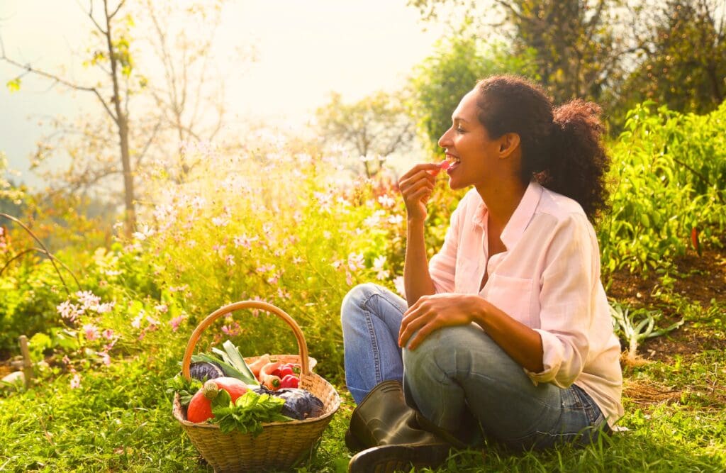 Woman eating her freshly picked vegetables. Gut brain connection. Brisbane Livewell Clinic Hypnotherapy