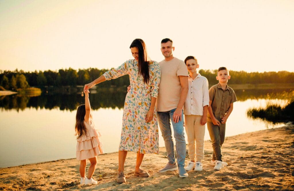 Family standing near the lake. Clinical Hypnotherapy Carina. Naturopaths Brisbane. FAQS. Brisbane Livewell Clinic