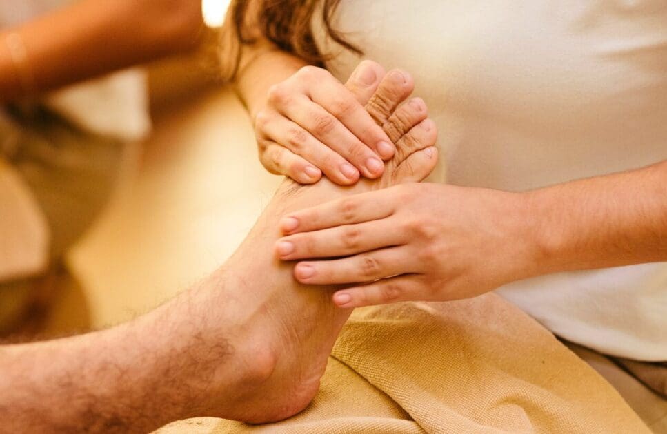 Person getting a foot reflexology massage. Reflexology Near Me. Brisbane Livewell Clinic