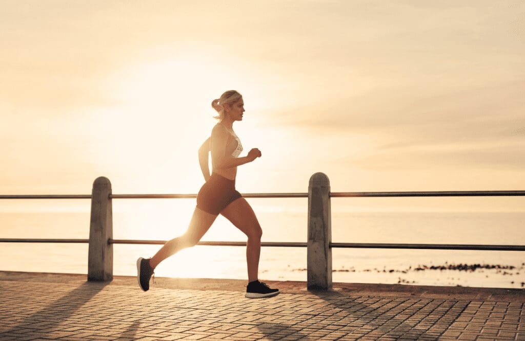 Woman running with more energy after seeing Nutritionist.