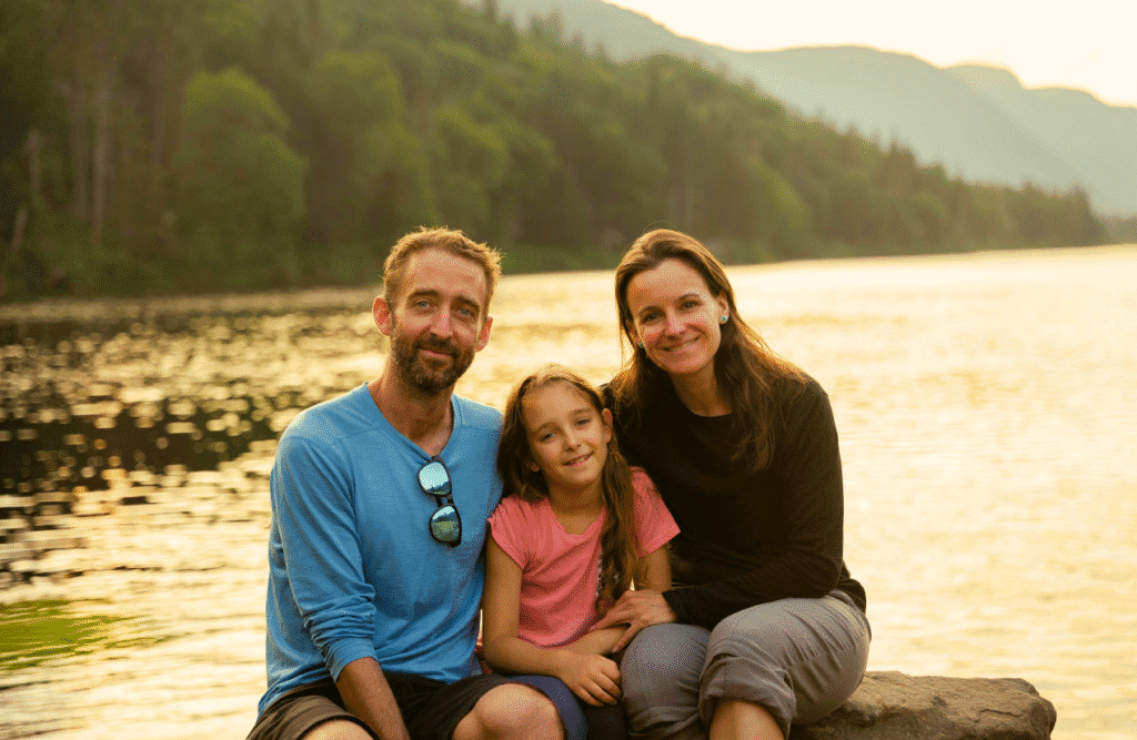 Family poses together on a rock near a lake. Naturopath Blood Test. Naturopath Herbs. MTHFR Gene Test. Brisbane Livewell Clinic
