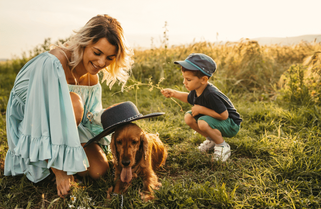 Mother and son playing with their dog in the field. Brisbane Wellbeing. Brisbane Livewell Clinic. Children's Naturopath