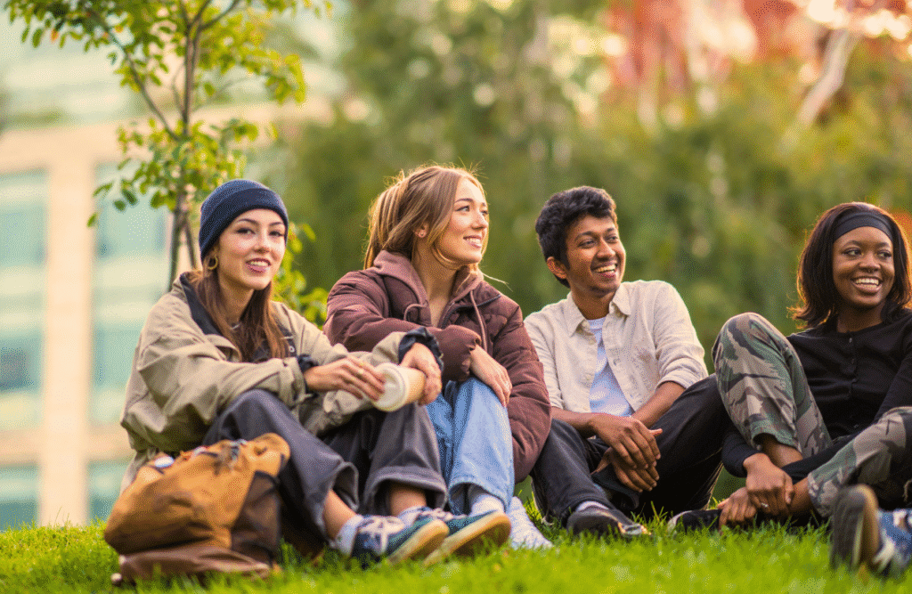 Group of young people talking and sharing laughter together. ADHD Naturopath. Iron deficiency and insomnia. Stress and how it manifests. How long to detox heavy metal from the body. Brisbane Livewell Clinic