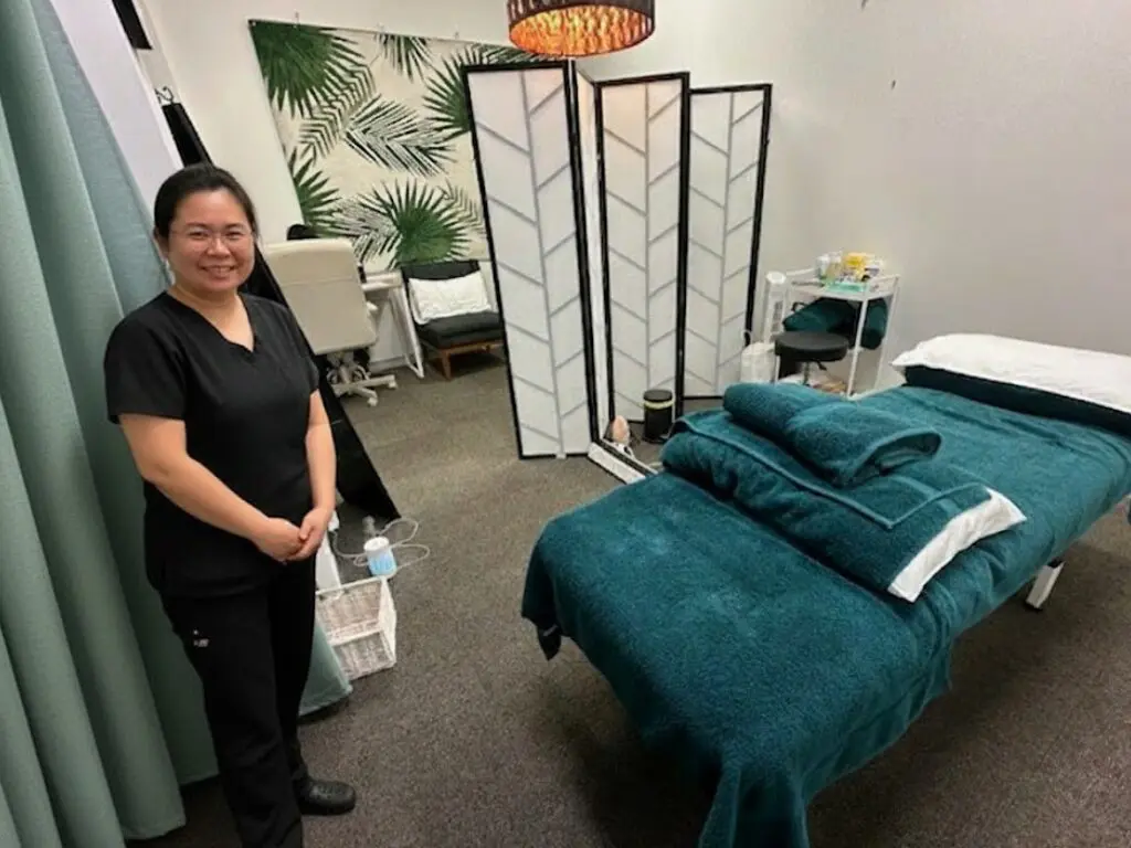 Rattana (Rainie) Chaisurayakan standing in her Massage room at our Wavell Heights Clinic
