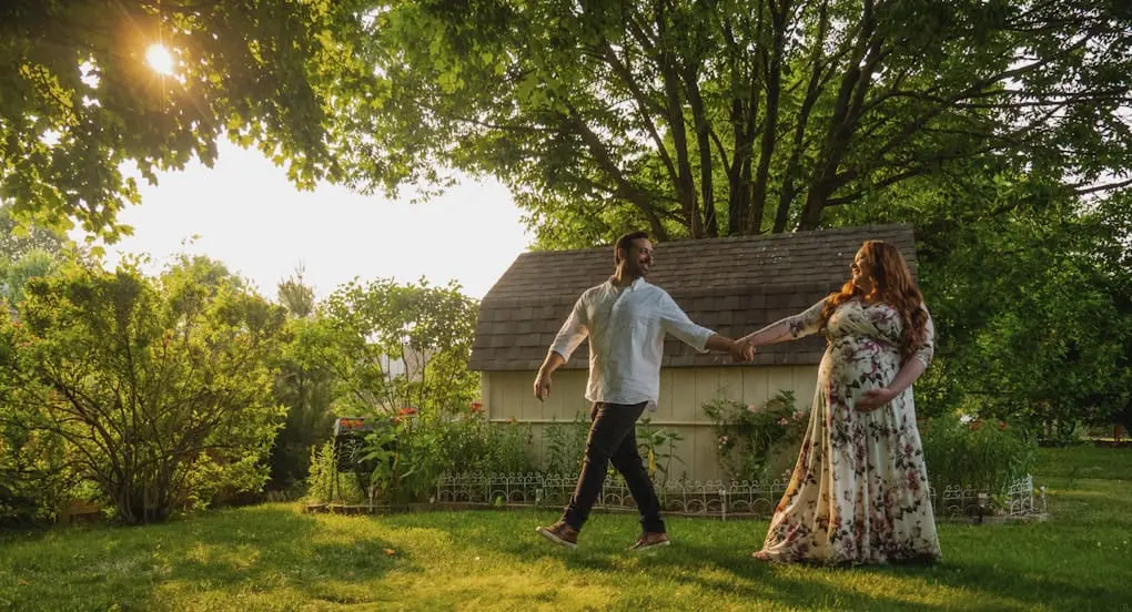 Man and pregnant woman dancing. Pregnant woman eating. Diet Planning Advice for Pregnant Women