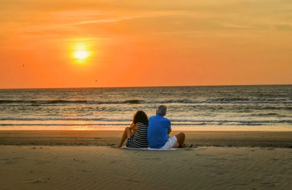 Couple sitting and watching sunset at the beach. Genetic Methylation Testing Australia. Brisbane Livewell Clinic