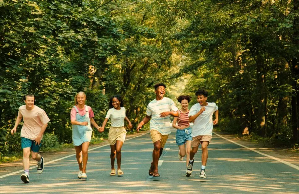 Group of friends running together along a forest road. Hypnotherapy near Virginia. Brisbane Livewell Clinic