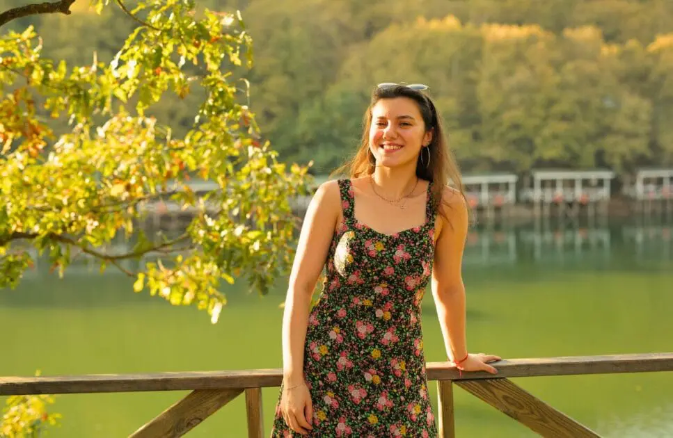 Smiling woman standing near the lake. Hypnotherapy near Virginia. How hypnosis helps with anxiety. Naturopath Women's Health. Chaste Tree. Brisbane Livewell Clinic
