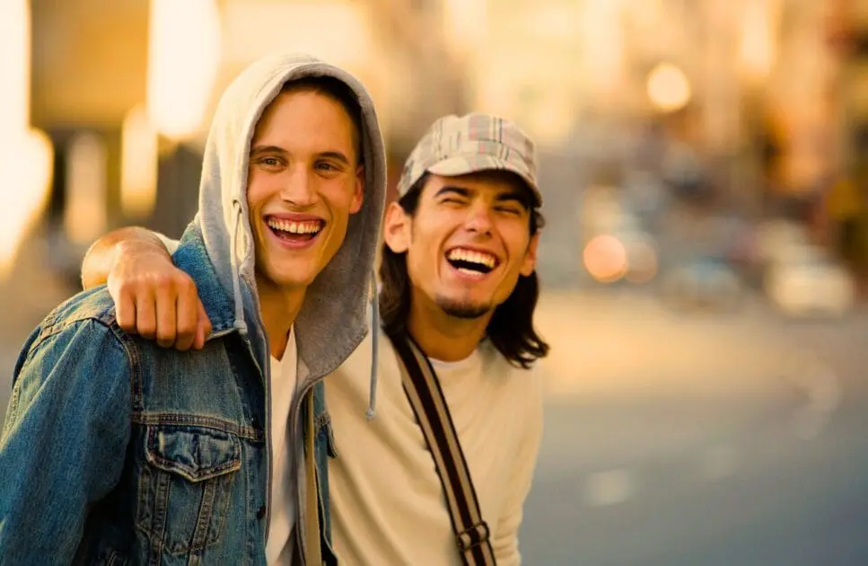 Two men with big smiles enjoying great times outdoors. Lymph Drainage. Ideal Bowen Massage Near Me. Clinical Nutritionist Cannon Hill. Osteopath for Jaw Pain and TMJ. Brisbane Livewell Clinic
