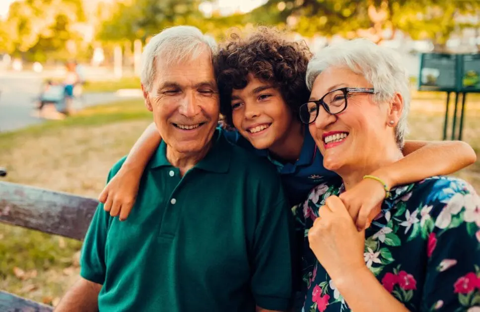 Young kid hugging his grandparents. Counsellor. Naturopath Toowoomba. Counselling Norman Park. Brisbane Livewell Clinic