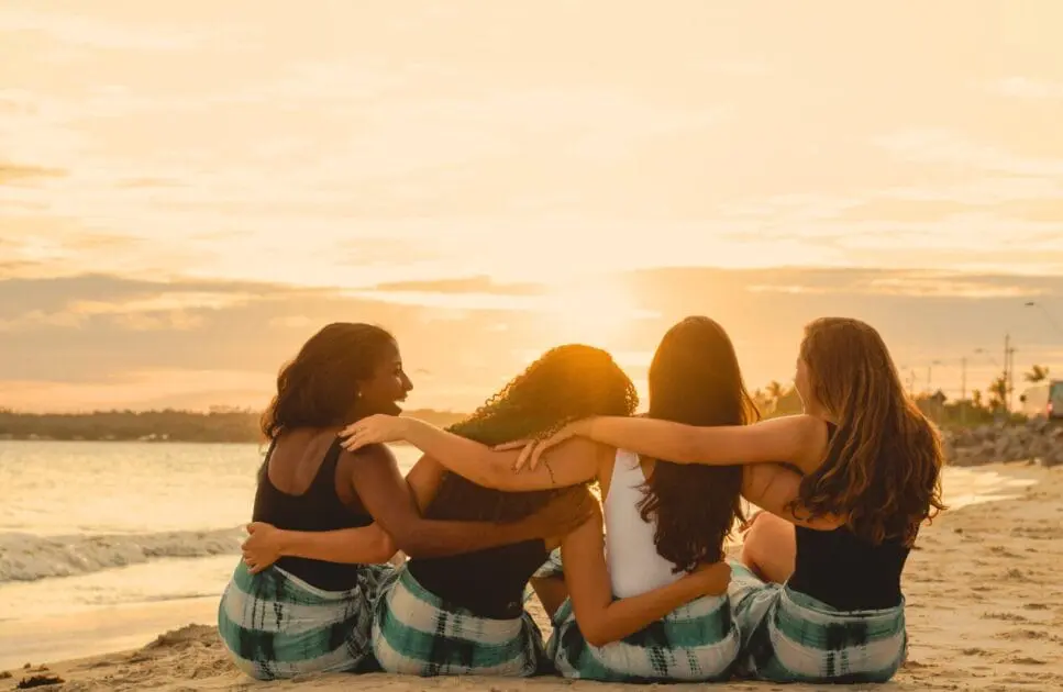 Group of women sitting on the beach. Holistic Counselling for Sensitive Adults. Counsellor Near Me. Counselling Clayfield. Brisbane Livewell Clinic