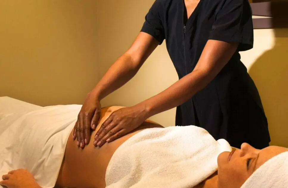 Pregnant woman enjoying a relaxing massage. Benefits of a Pregnancy Massage. Pregnancy Massage. Brisbane Livewell Clinic