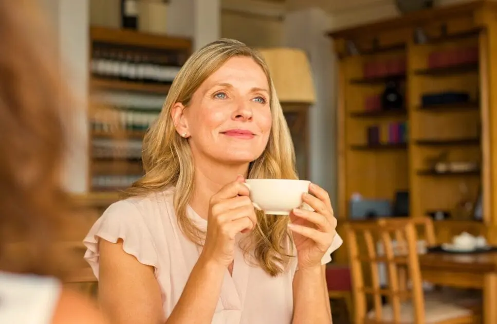 Woman holding a cup of coffee. Acupuncture and Menopause. Menopausal Symptoms. Counselling for Adults Who Are Tired of Pretending. Brisbane Livewell Clinic
