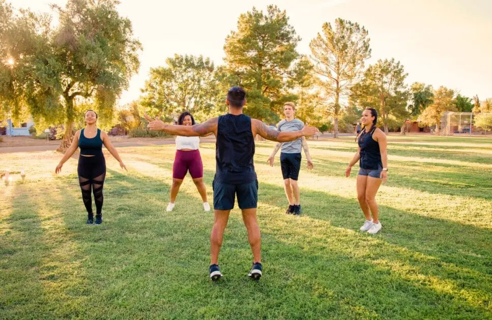 Group of people exercising outdoors. Naturopathy Brisbane. Lose Weight Hypnotherapy. Brisbane Livewell Clinic