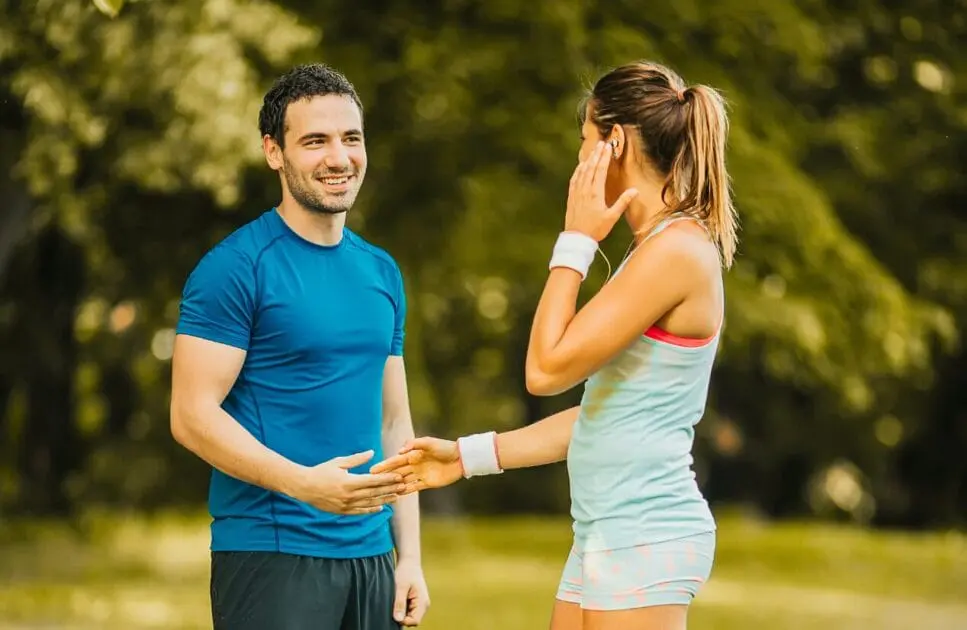 Man and woman having a conversation at the park. Methylation Test Near Me. Holistic Counselling for Disconnection. Osteopath for Jaw Pain and TMJ. Brisbane Livewell Clinic