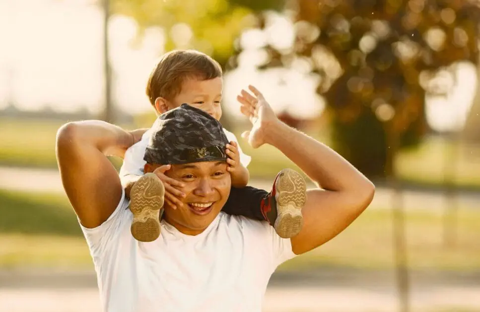 Father carrying his young child on his shoulders. Testing Functional Medicine. Brisbane Livewell Clinic